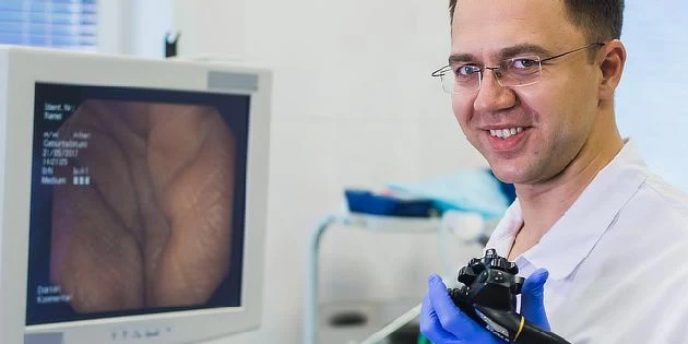 Doctor with endoscope monitor