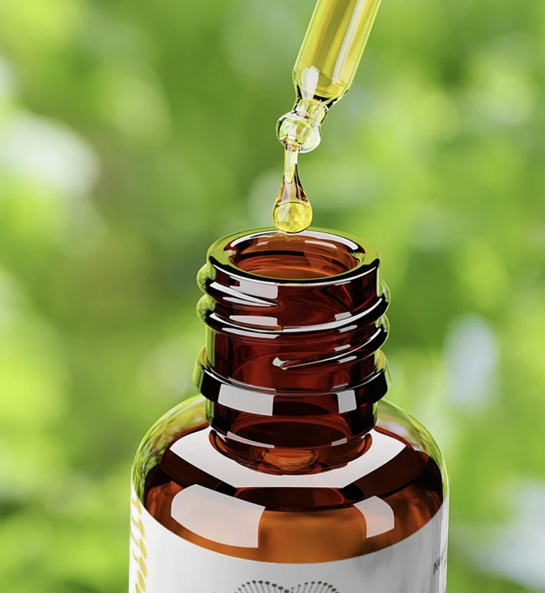 Kapka oleje s vitamíny D3 a K2 padá do lahvičky.